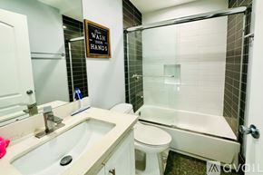 Los Angeles townhouse for rent - A bathroom with a sink, toilet, and shower.