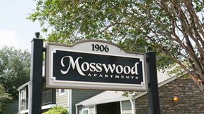 Victoria townhouse for rent - A sign for Mosswood Apartments is displayed in front of a building.