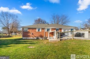 Hagerstown house for rent - A red brick house with a white door and windows is for sale.