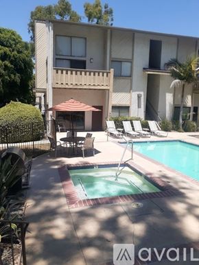 Los Angeles condo for rent - A pool and patio area in front of a building.