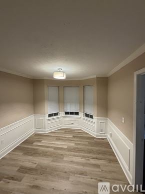 Jackson townhouse for rent - A room with a light on the ceiling and a window with blinds.