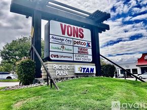 San Diego house for rent - A large sign for VONS Massage Spa is displayed in front of a building.