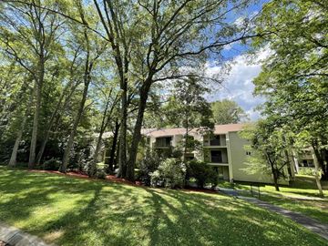 State College apartment for rent - A green lawn in front of a building.