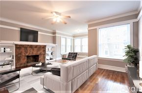 Chicago apartment for rent - A living room with a fireplace and a couch.