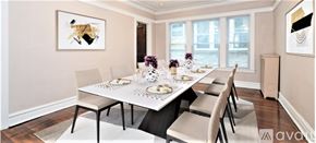 Chicago apartment for rent - A dining room with a white table and chairs.