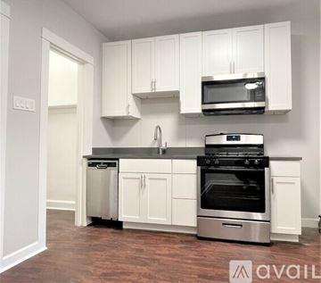 Chicago apartment for rent - A kitchen with white cabinets and stainless steel appliances.