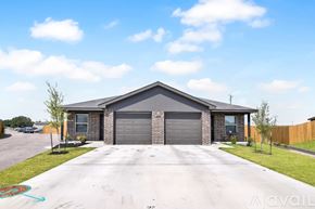Killeen apartment for rent - A house with a grey garage door is for sale.
