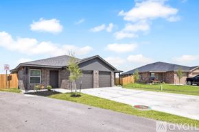 Killeen apartment for rent - A house with a driveway and a tree in front of it.