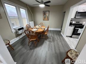Ventnor City house for rent - A dining room with a wooden table and chairs.