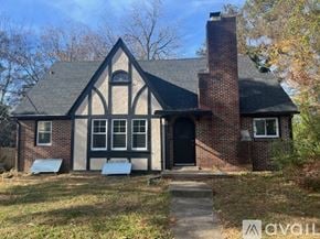 Hopewell house for rent - A house with a black door and a brick chimney.