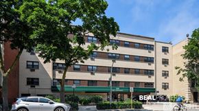 Chicago condo for rent - A building with the words BEALPROPERTY on the front.