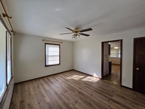 Hammond house for rent - A room with a ceiling fan and wooden flooring.