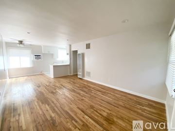 Los Angeles apartment for rent - A kitchen with white cabinets and a marble countertop.