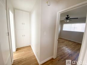 Los Angeles apartment for rent - A kitchen with a fan on the ceiling and a window with a view of trees.