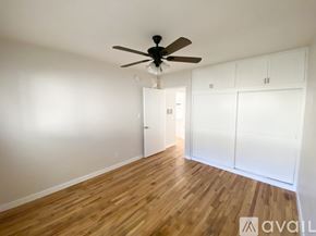 Los Angeles apartment for rent - A room with a ceiling fan and a window.
