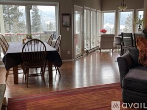 Breckenridge house for rent - A dining room with a table set for six and a view of the outdoors.
