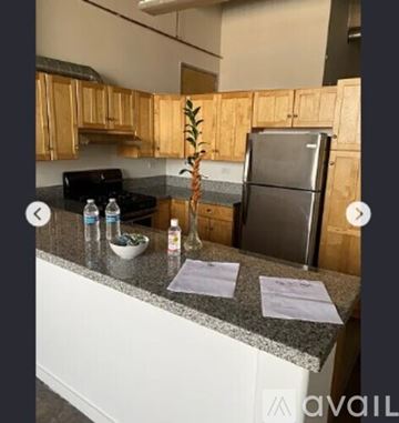 Los Angeles apartment for rent - A kitchen with wooden cabinets and a granite countertop.