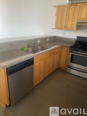 Los Angeles apartment for rent - A kitchen with wooden cabinets and a granite countertop.