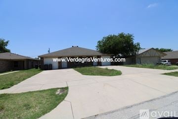 Fort Worth house for rent - A residential area with houses and a clear sky.