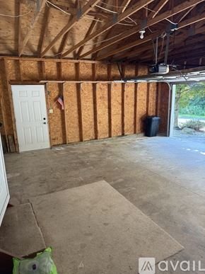Honesdale townhouse for rent - A room under construction with a white door and a flag hanging on the wall.