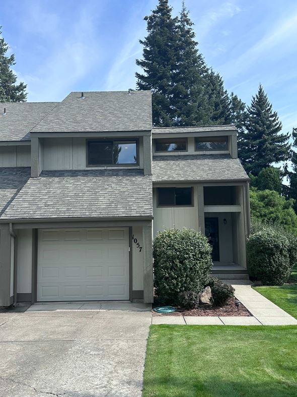 Hayden apartment for rent - A house with a grey roof and a white garage door.