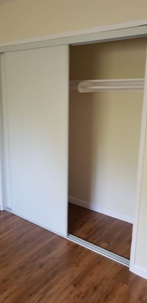 Cudahy apartment for rent - A white closet with a shelf and a mirror.