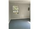 Mobile house for rent - A white wall with a poster and a switchboard.