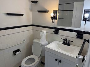 Hartford house for rent - A white toilet and sink in a bathroom.