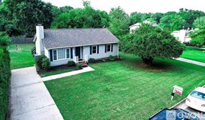 Fuquay Varina house for rent - A house with a white car parked in front.