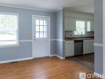 Fuquay Varina house for rent - A kitchen with a sink and cabinets.