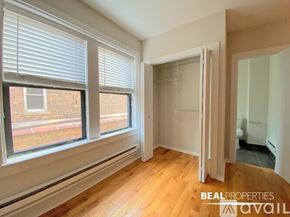 Chicago apartment for rent - A room with a window and wooden floors is on the market through Beal Properties.