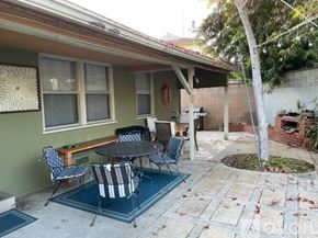 Los Angeles house for rent - A patio with a table and chairs is shown.
