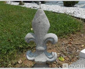 Earlysville apartment for rent - A grey fleur de lis sculpture sits in a grassy area.