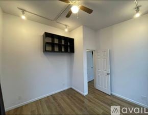 Richmond County house for rent - A room with a ceiling fan and a door leading to another room.