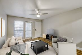 Mesa apartment for rent - A dining room with a glass table and red chairs.