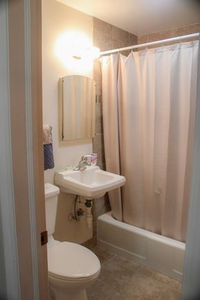 Fremont apartment for rent - A white toilet sits next to a sink in a small bathroom.