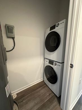 Oak Park apartment for rent - A washing machine is placed next to a dryer in a small room.