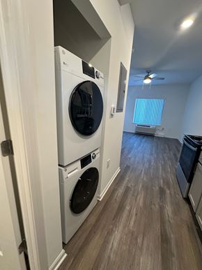 Oak Park apartment for rent - A laundry room with a washer and dryer stacked on top of each other.