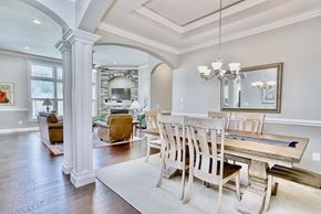 Greer house for rent - A dining room with a wooden table and chairs.
