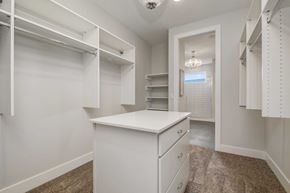 Lake Elmo house for rent - A white kitchen with a white counter and white cabinets.
