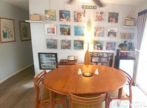 Kapaa apartment for rent - A dining room with a wooden table and chairs.