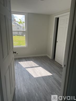 Black River apartment for rent - A room with a window and a door.