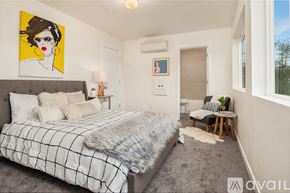 Monroe townhouse for rent - A row of modern houses with garages in front.