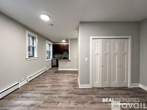 Chicago apartment for rent - A room with a white door and a window with white frames.