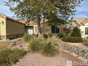 Henderson apartment for rent - A house with a tree in front of it.