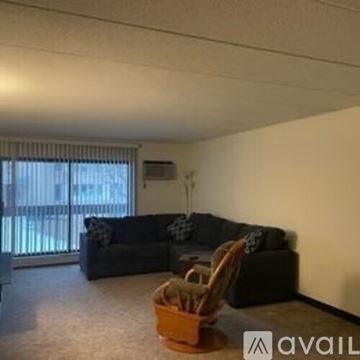 La Crosse apartment for rent - A living room with a couch and a chair.