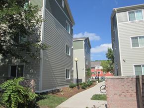 Des Moines apartment for rent - A residential area with apartment buildings and a sidewalk.