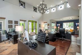 Sacramento apartment for rent - A modern office space with desks, computers, and chairs.