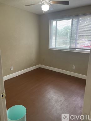 Orlando apartment for rent - A room with a window and a fan.
