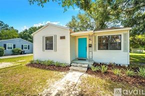 St. Petersburg house for rent - A small house with a blue door is for sale.